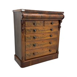 19th century flame mahogany Scotch chest, frieze long drawer above two short and four long graduating drawers, with turned knobs scrolled carved side bracket 