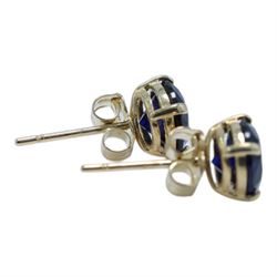 Pair of 9ct gold blue stone stud earrings, boxed