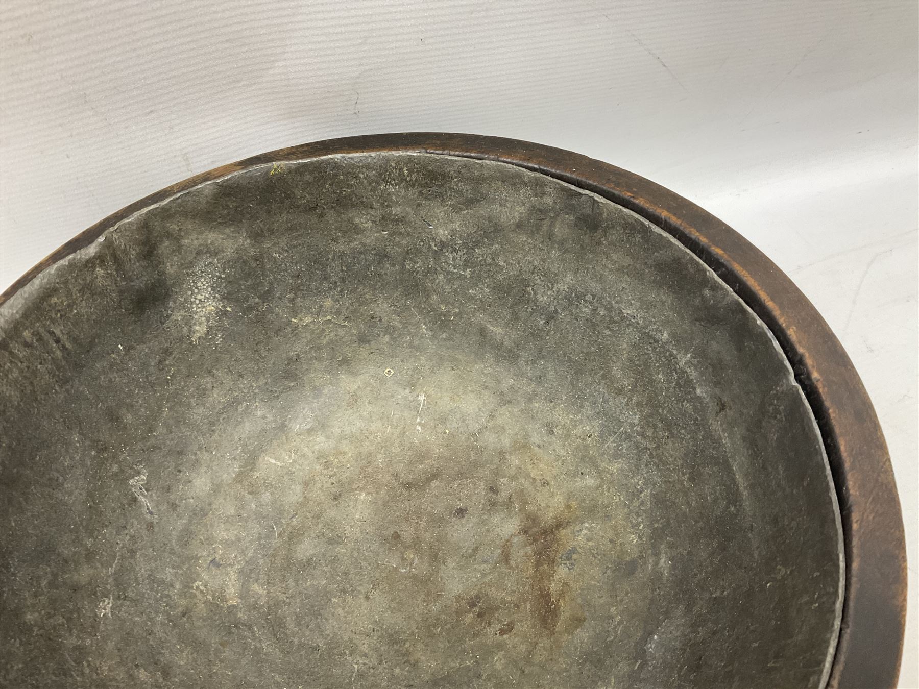 19th century pole lathe turned sycamore bowl, the interior housing lead liner, the exterior decorated with bands of deep grooves, D28cm