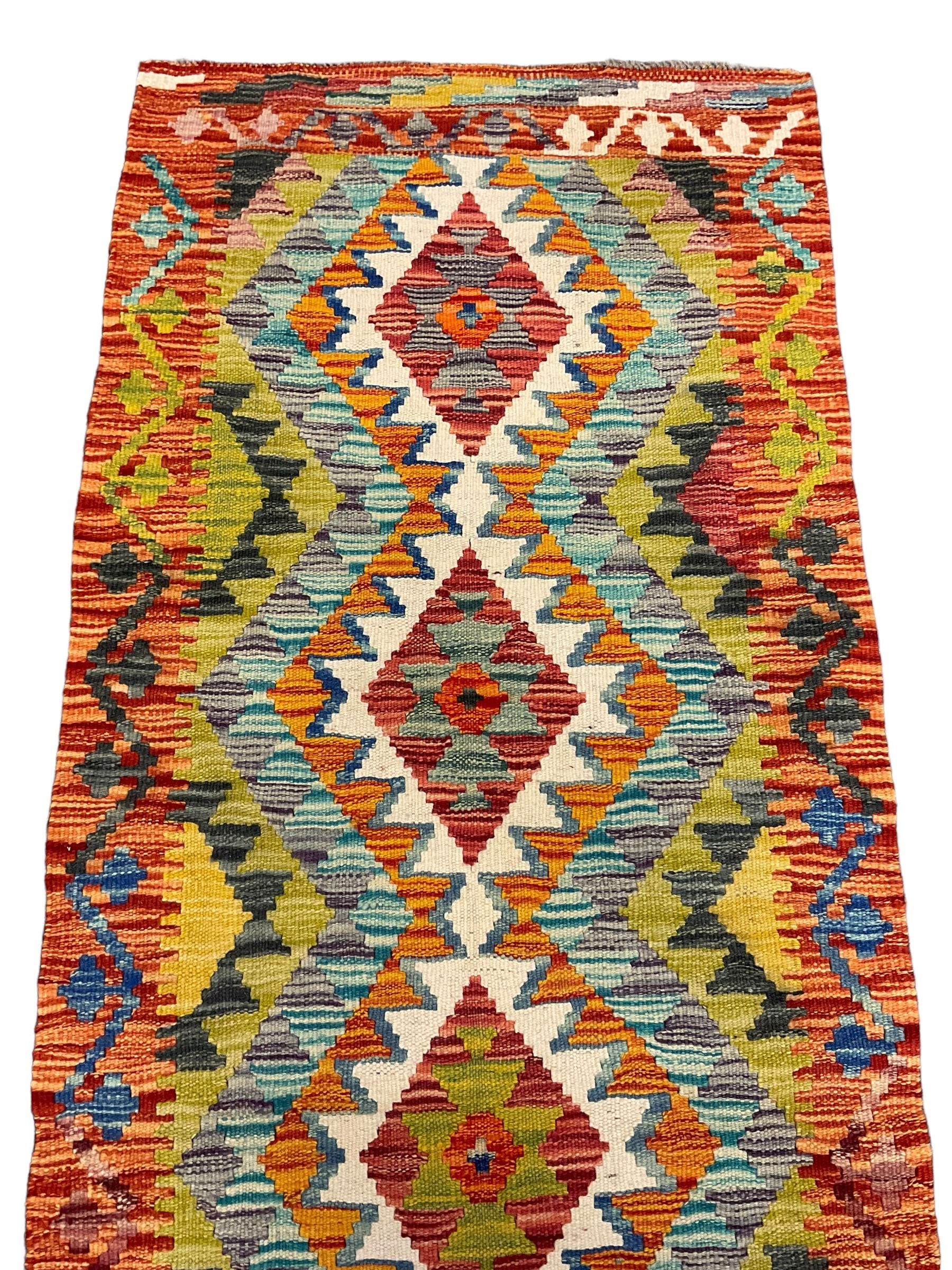 Chobi Kilim multi-coloured ground geometric design rug