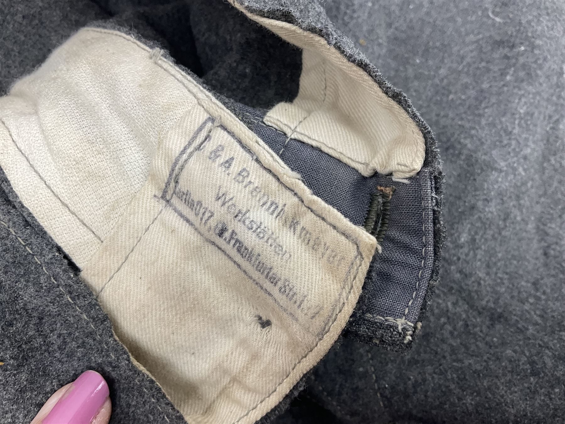 Pair of WW2 German Other Ranks trousers c1940-42, stamped C.& A. Brenninkmeyer Workstatten; WW2 German Army webbing belt with steel 'Gott Mit Uns' buckle; and WW2 German leather belt with 'Stahlhelm' (Steel Helmet League) members buckle (3)