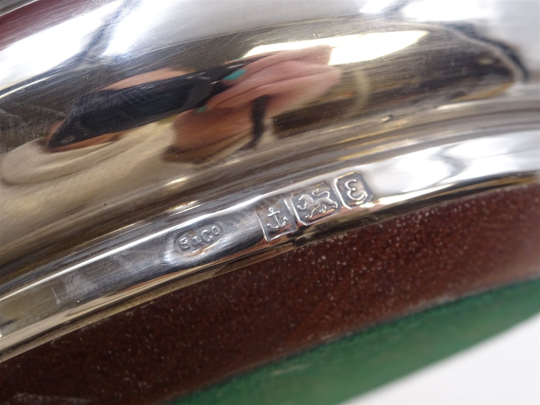 Modern silver mounted bottle coaster, of plain circular form with turned mahogany centre, hallmarked W I Broadway & Co, Birmingham 1979, D13cm