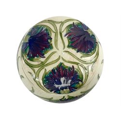 Moorcroft tobacco jar, circa 1913-1914, of squat bulbous form with screw threaded cover, decorated in the Revived Cornflower pattern, with impressed and painted marks beneath, H10cm.