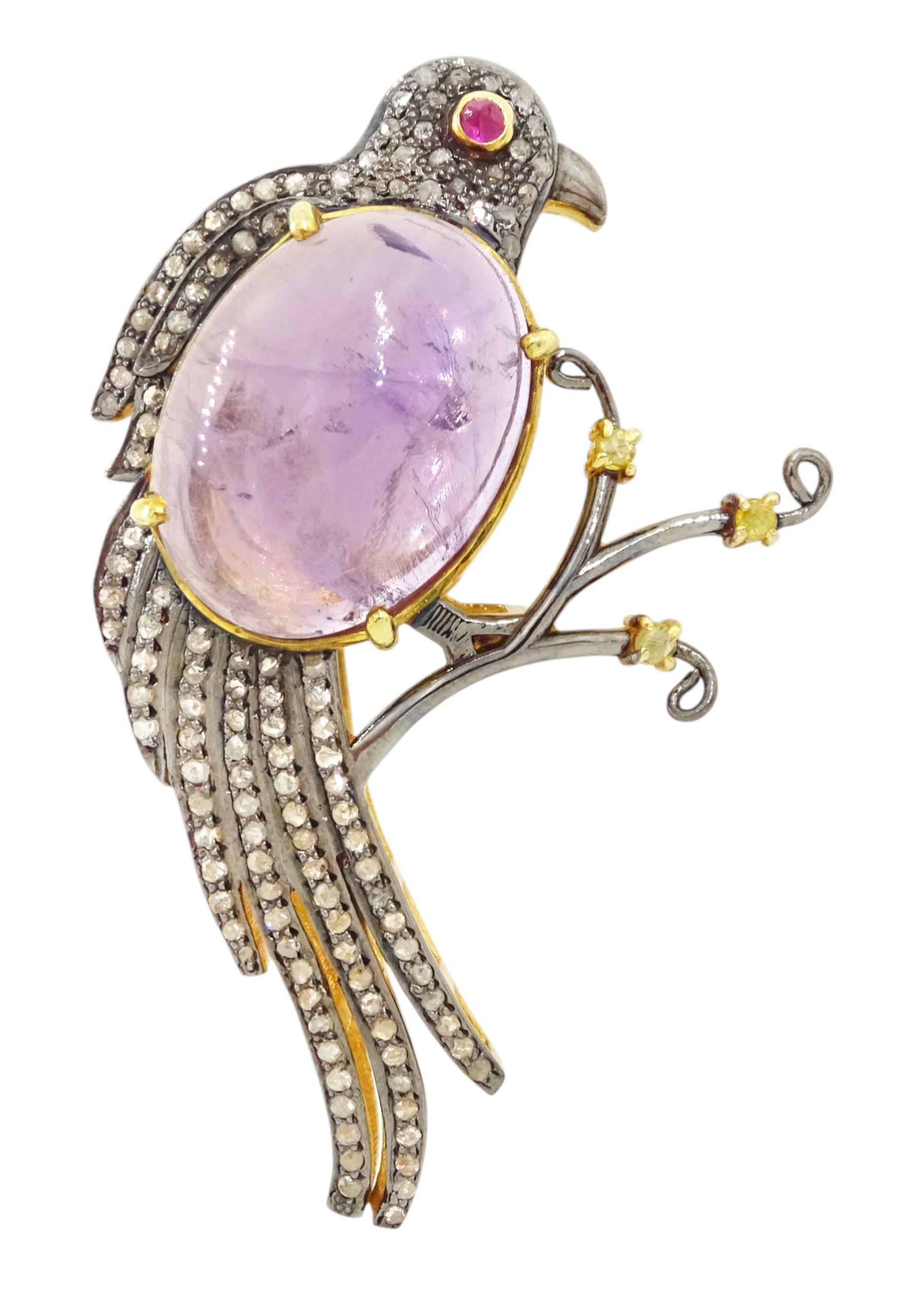 Silver and silver-gilt amethyst, ruby and diamond bird brooch, large cabochon amethyst of approx 12.30 carat, with diamond set feathers and ruby eye, total diamond weight approx 1.15 carat