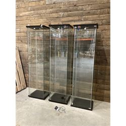 Three Ikea rosewood finish illuminated four glass shop display cabinets, with shelves and keys
