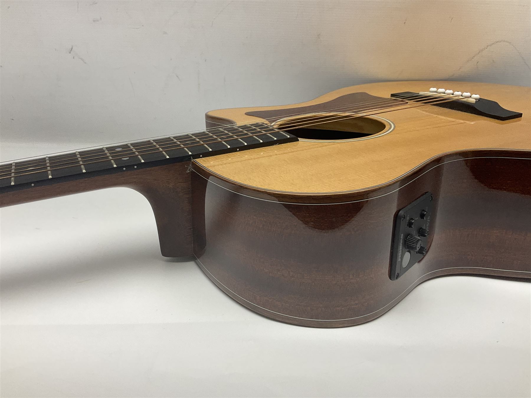 Sigma GMC-1E semi-acoustic guitar with cut-away body, sapele mahogany back and ribs and solid spruce top; bears label Model GMC-1E serial no.210522747; L103cm