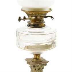 Pair of Victorian table oil lamps with clear glass reservoirs on brass Corinthian columns and stepped square bases with chimneys and etched glass shades H71cm overall