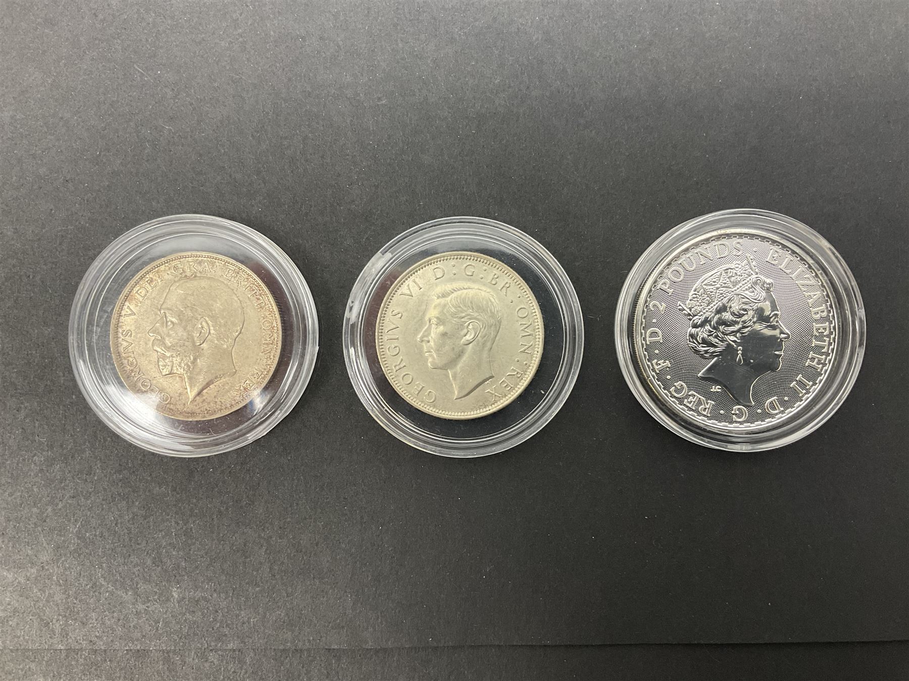 Queen Elizabeth II 2017 one ounce fine silver Britannia coin, The Royal Mint 2013 fine silver twenty pound coin on card, King George VI 1945 halfcrown and King George V 1916 halfcrown