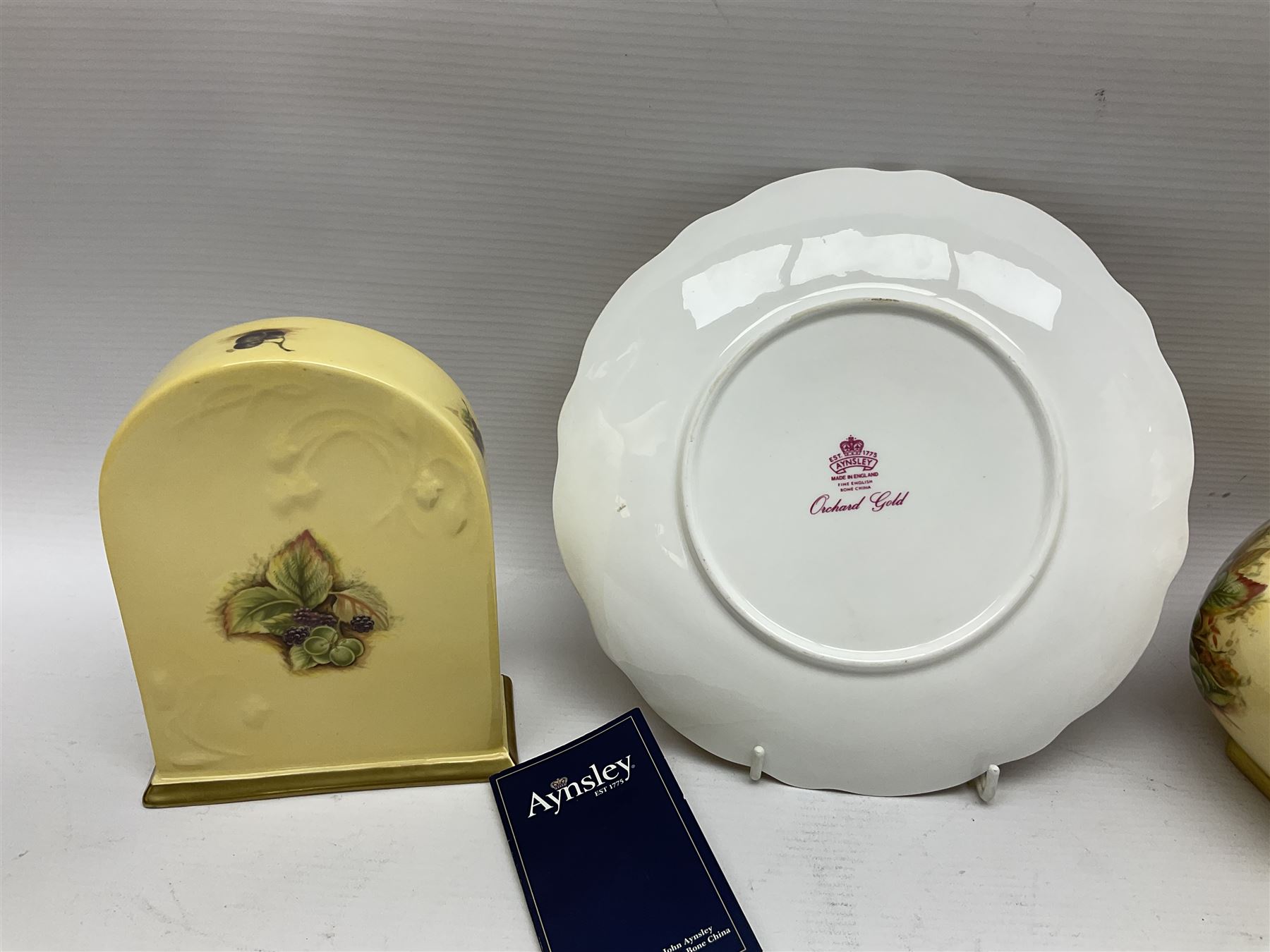 Aynsley Orchard Gold five coffee cans and saucers, mantel clock, plate etc 