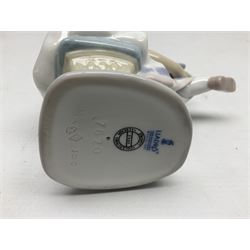 Six Lladro figures, comprising Naughty Dog no 4982, Best Friend 7620 and My Buddy no 7609, Kitty Confrontation no 1442, It Wasn't Me no 7672 and Rabbit Eating no 4772, three with original boxes, largest example H22cm