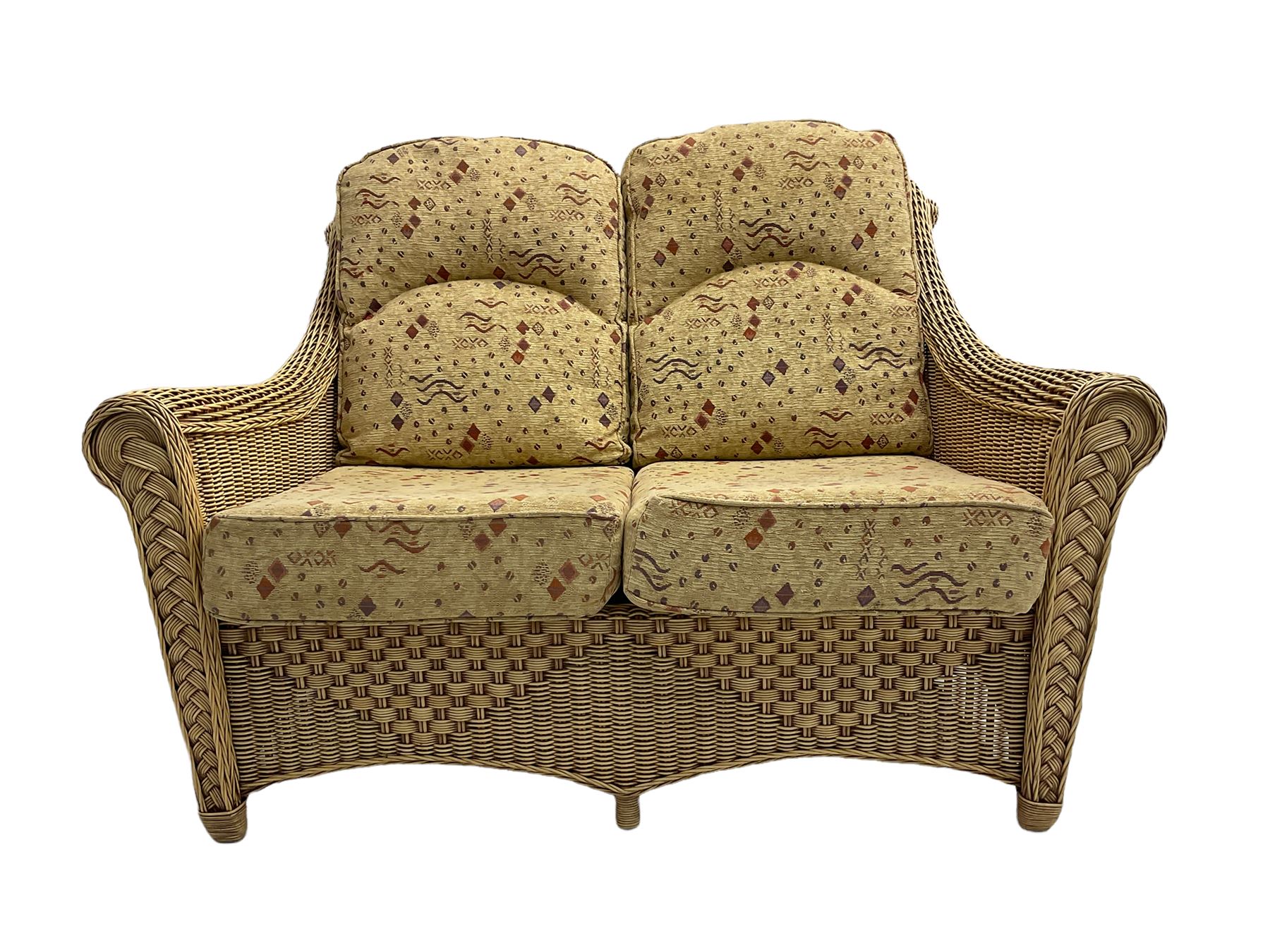Four piece cane conservatory suite - two seat sofa (W130cm), pair of armchairs (W85cm), and coffee table (85cm x 60cm)