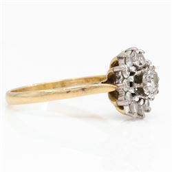 Gold diamond flower head cluster ring, single round brilliant cut diamond, surrounded by twelve further diamonds, stamped 18ct