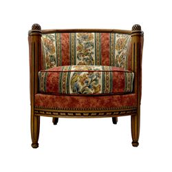 Pair of cherry wood framed tub-shaped armchairs, upholstered in striped floral fabric with brass stud trim, carved walnut frame with fluted supports capped with pinecone finials, on turned feet