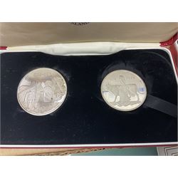 Coins including two King George VI 1951 Festival of Britain crowns each in green case, various other commemorative crowns, two Iceland '874-1974' two coin sets both in original red cases etc