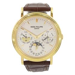 Patek Philippe 18ct gold perpetual calendar automatic wristwatch, Ref. 5039J, Cal. 240 Q, Movement 27 jewels, No. 775255, silvered dial with moon phases, 24 hour and leap year indication, with Patek Philippe Certificate of Origin, purchased 24 April 1997, service history, on Patek brown leather strap with 18ct gold buckle and additional black leather strap