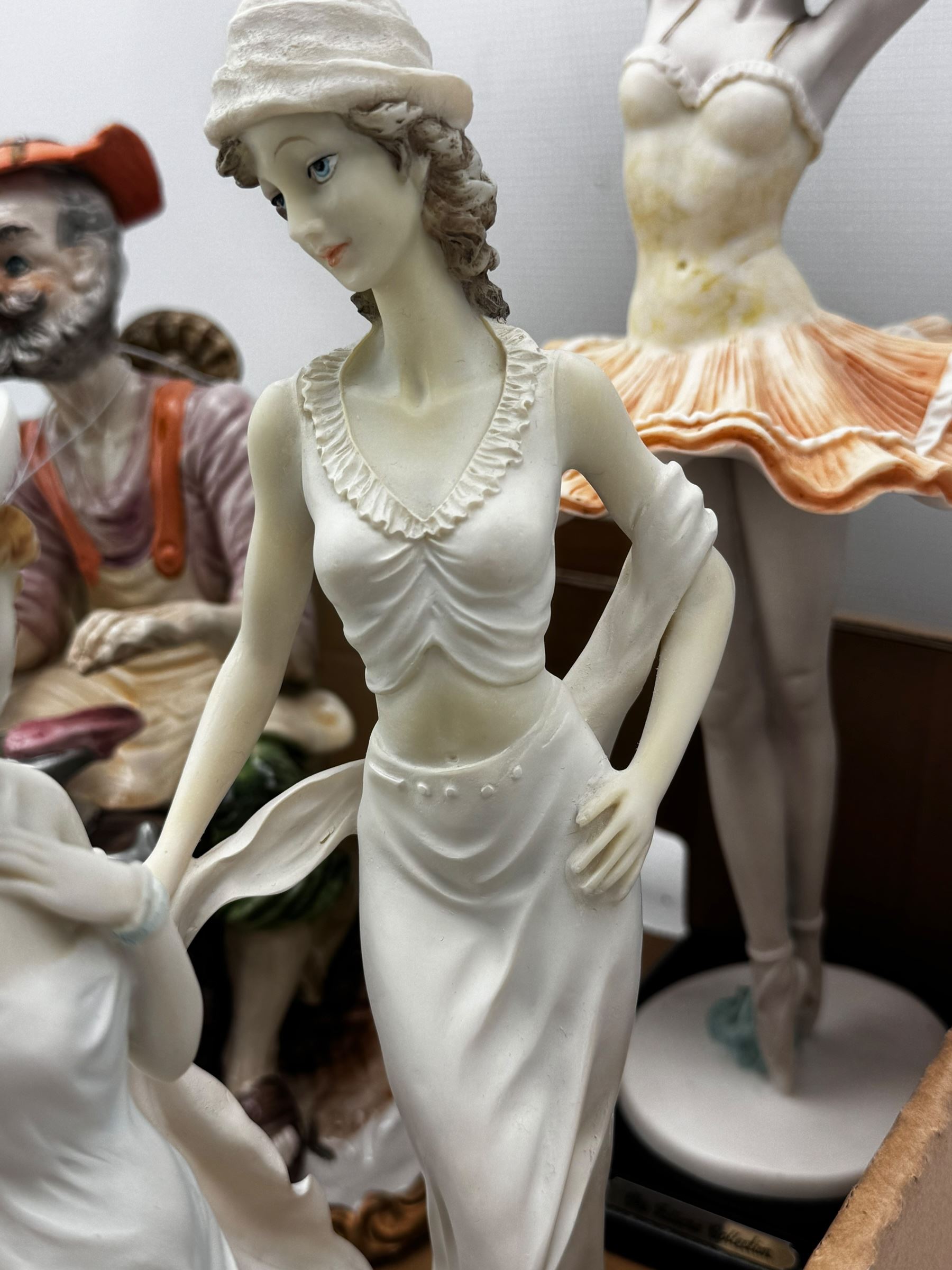 Five ‘The Juliana Collection’ figures, Capodimonte figure of a cobbler, four decorative cat plates, another decorative plates and Aynsley china