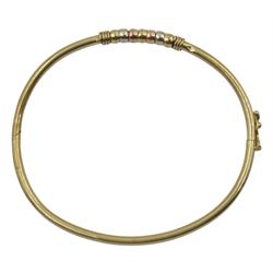 9ct gold gold hinged bangle, with rose, yellow and white gold spinner decoration, hallmarked