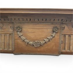 19th century Adams design pine fire surround, egg-and-dart carving over Vitruvian scrolls and fluted frieze, decorated with applied carved festoons and garlands, on fluted uprights