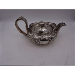 George III Irish silver teapot, of squat circular form, the body with repousse and chased floral and C scroll decoration, with capped C handle and ivory insulators, engraved to base 'Presented to Troop Sergeant Major John Percival, of the 4th Dragoon Guards by Alex D. Tait, Esq, late Captain in that corps as a mark of approbation of his steady and upright conduct when Sergeant Major of his Troop, Dublin, June 2nd 1843', hallmarked William Law, Dublin 1817, H12.5cm, This item has been registered for sale under Section 10 of the APHA Ivory Act