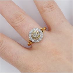 Early 20th century 18ct gold old cut diamond cluster ring, the central fancy light brown diamond of approx 1.60 carat, with a milgrain set white diamond surround of approx 0.45 carat, with Guest & Philips insurance valuation