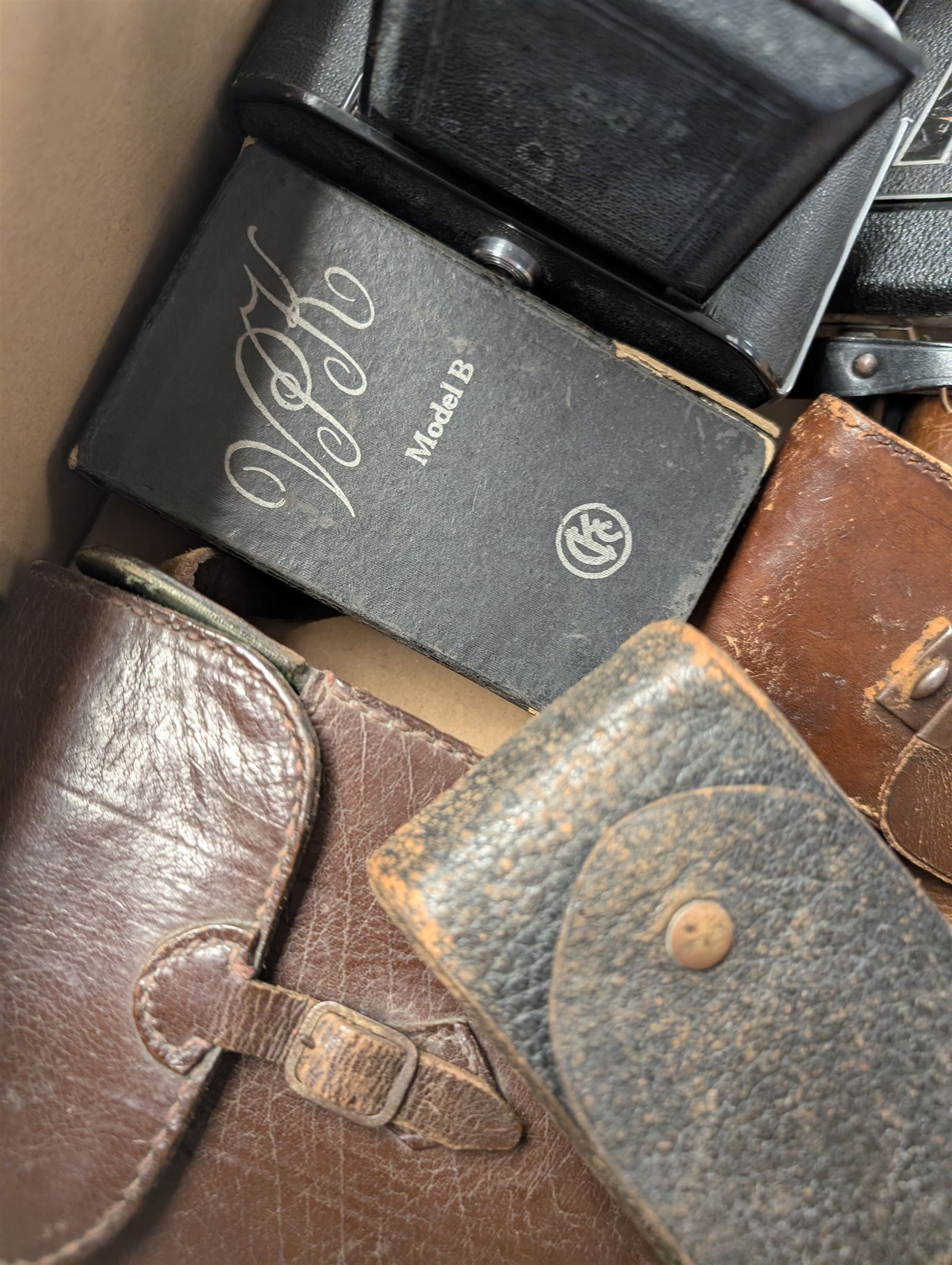Twelve folding cameras and similar, including Afga, Jiffy Kodak, Solida Jr examples, together with light meters, Polaroid camera and other camera accessories