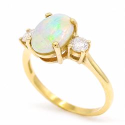 18ct god opal and diamond three stone ring, single oval cabochon cut opal of approx 2.80 carat, with a round brilliant cut diamond set either side, hallmarked, total diamond weight approx 0.25 carat