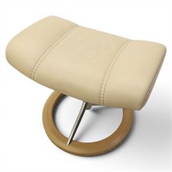 Ekornes - Stressless reclining beige leather armchair and stool, raised on brushed steel frame, light oak rotating base