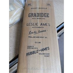 Two signed cricket bats, with signatures including Colin Cowdrey