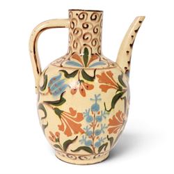Iznik-style ewer, late 19th/early 20th century, the ovoid body painted with stylized flowers upon a cream ground, the neck with repeating scrolling boarder, H28cm