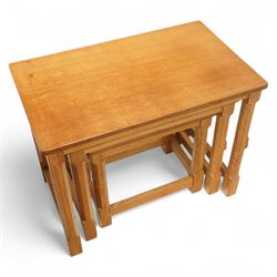 Mouseman - nest of three oak occasional tables, rectangular adzed top, on octagonal supports united by plain stretchers, each carved with mouse signature, by the workshop of Robert Thompson, Kilburn 