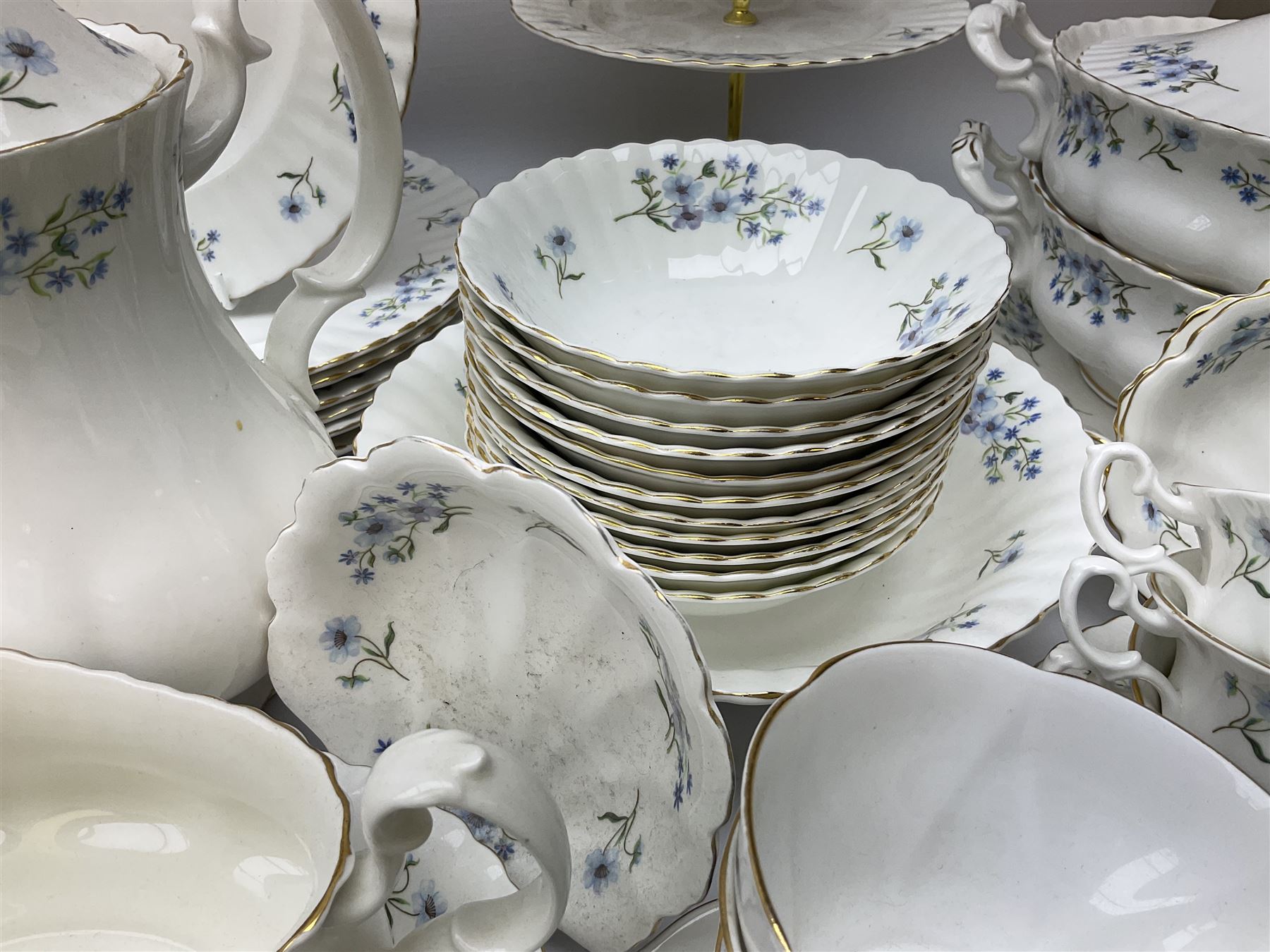 Extensive Richmond Blue Rock pattern part tea and dinner service, to include seven dinner plates, nine smaller plates, three lidded twin handled tureens, two teapots and two coffee pots, eleven bowls, cake stand, six twin handled soup bowls and saucers, six teacups, four coffee cups, milk jugs, sucrier, cake plate, salt and pepper shakers, other plates, dishes, bowls, side plates and many spares etc