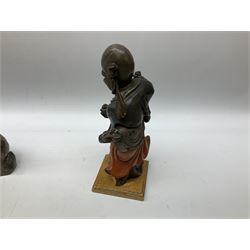 Three soapstone carvings, to include three toed dragon example, carved example with monkeys and another similar, together with carved wood figure, largest L29cm 