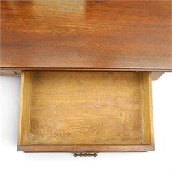 Late Victorian figured walnut and mahogany dressing table, raised swing-mirror back over trinket drawers, fitted with two drawers with brass Aesthetic Movement handles, on ring-turned supports with ceramic castors