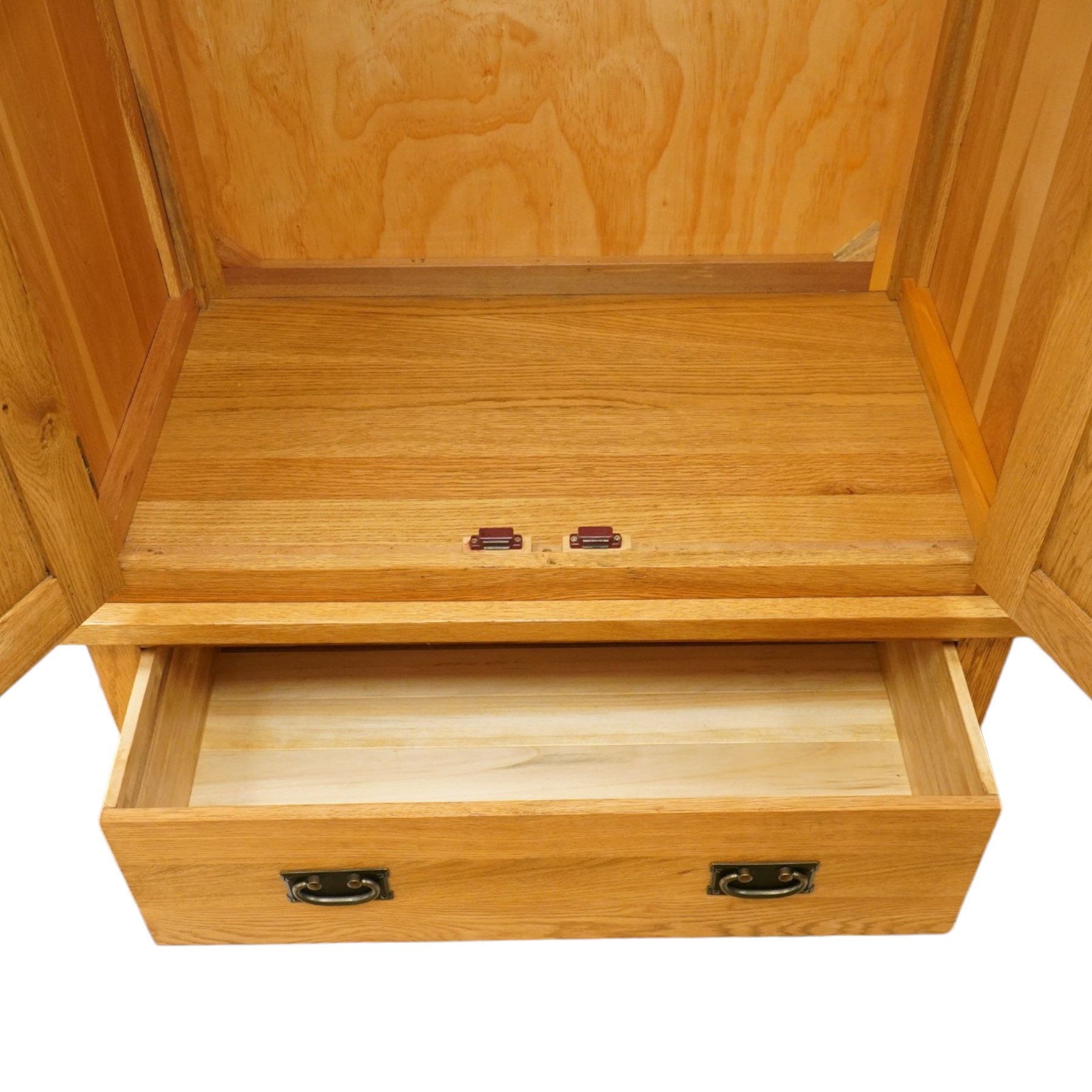 Contemporary light oak double wardrobe, fitted with two panelled cupboards over single drawer