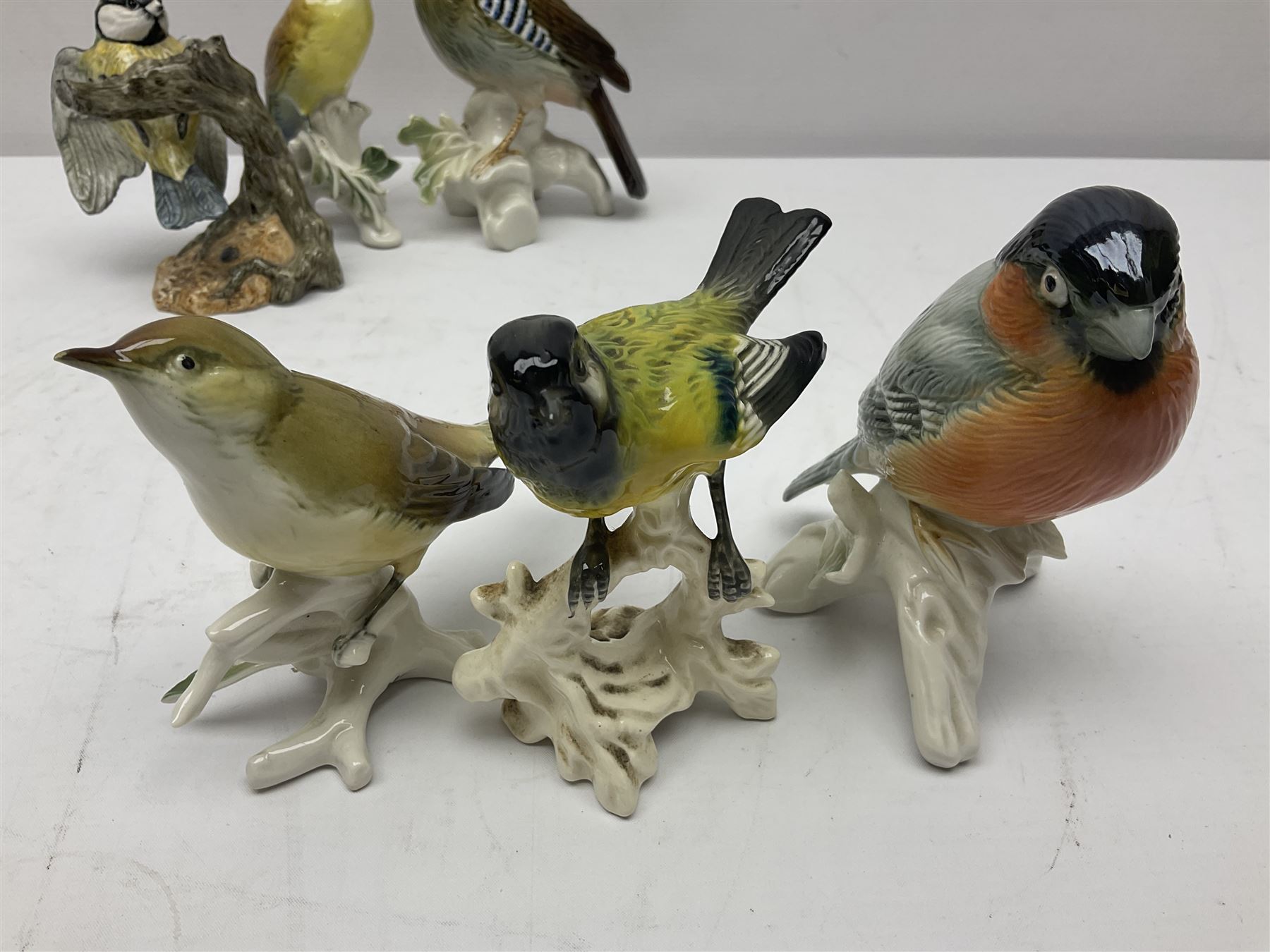 Eight Karl Ens bird figures, together with Mack blue tit and one other