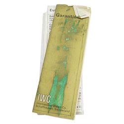 International Watch Company ladies 18ct gold manual wind wristwatch, silvered dial with baton hour markers, on integral 18ct gold bracelet, stamped 750, with guarantee dated 1968