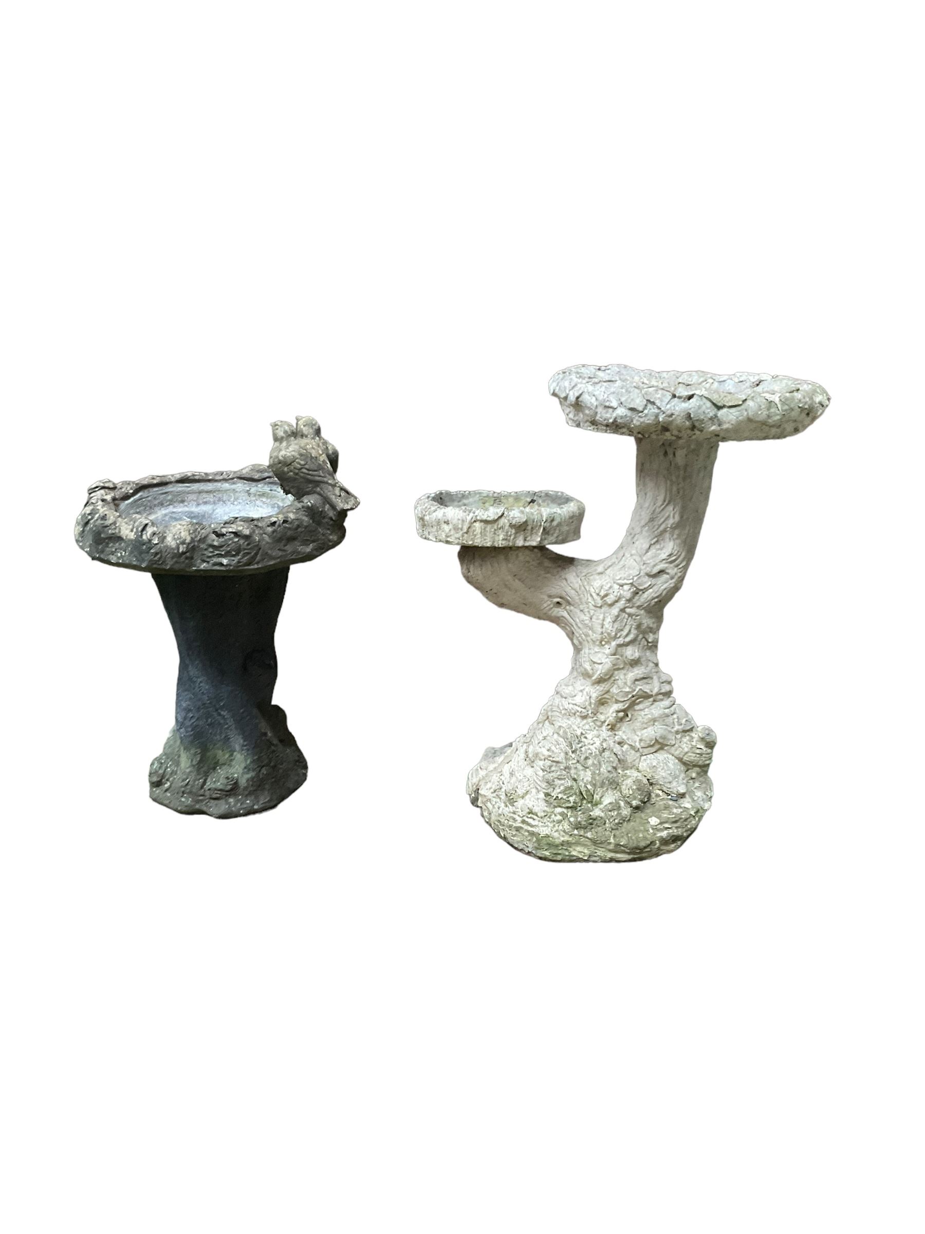 Two cast stone tree bird baths