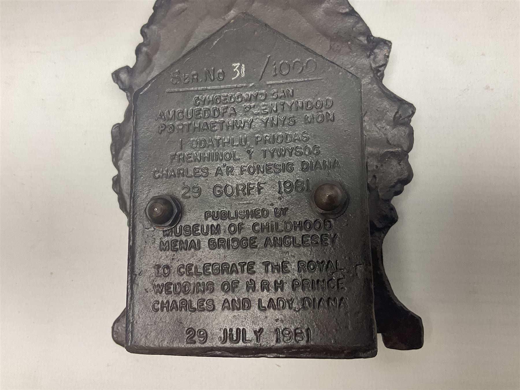 Two early 20th century cast-iron money banks - 'Our Kitchener Bank' c1914 H17cm and 'Our Empire Bank' c1911 depicting George V and Queen Mary H17cm; both by Sydenham & McCoustra; and another similar for The Prince & Princess of Wales 1981 by Robert Brown (3)