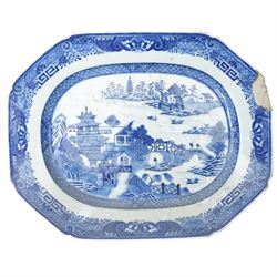  18th century Chinese export platter decorated in blue and white with a river landscape W40cm and two other Chinese export platters (3)