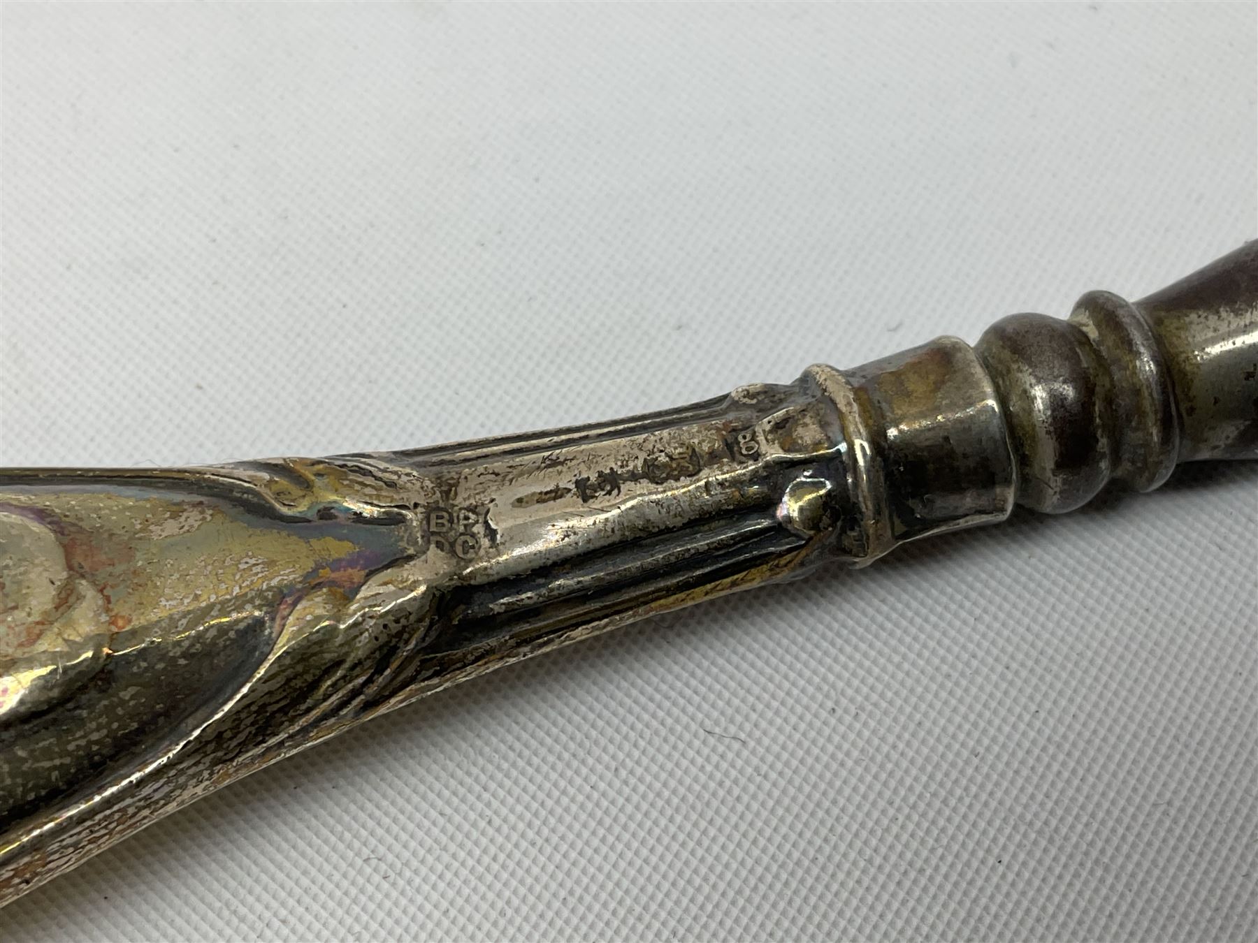 Set of six silver handled butter knives, and a silver handled shoehorn, all hallmarked, but hallmarks worn and indistinct