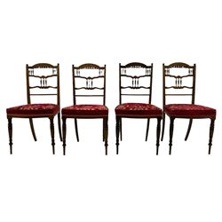 Edwardian inlaid rosewood salon suite, upholstered in red and gold fabric, comprising two seat sofa, pair of tub shaped armchairs, and four side chairs