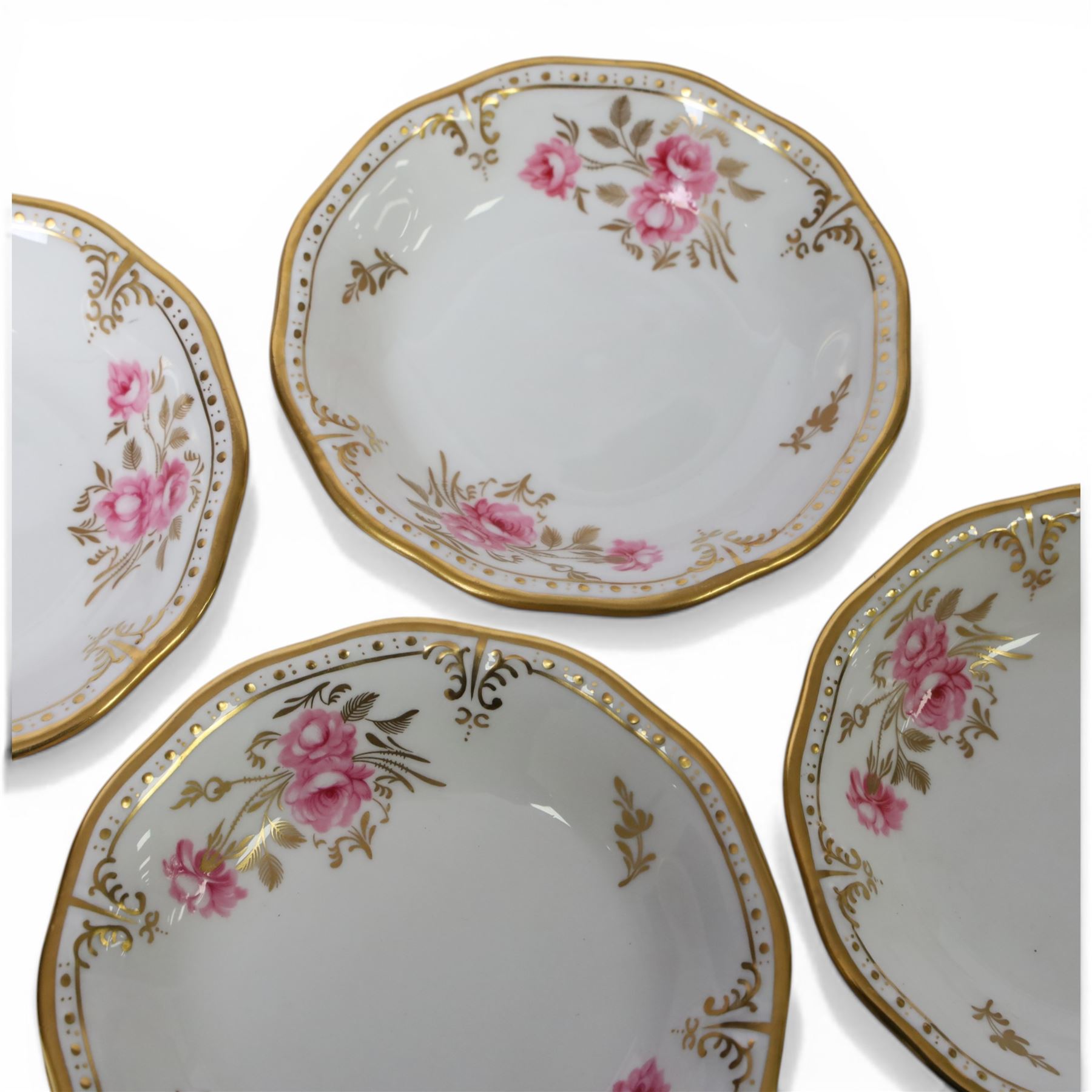 Modern Royal Crown Derby tea set for six place settings, decorated in the Royal Pinxton Roses pattern, comprising tea cups, saucers, small dishes, side plates, dessert plates, one serving plate, twin handled lidded sucrier and milk jug