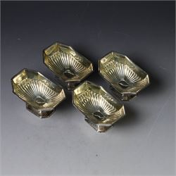 Set of four late Victorian silver open salts, of octagonal part fluted form, with four clam shell spoons, hallmarked Colen Hewer Cheshire, Birmingham 1896, salts H4cm, contained within fitted case