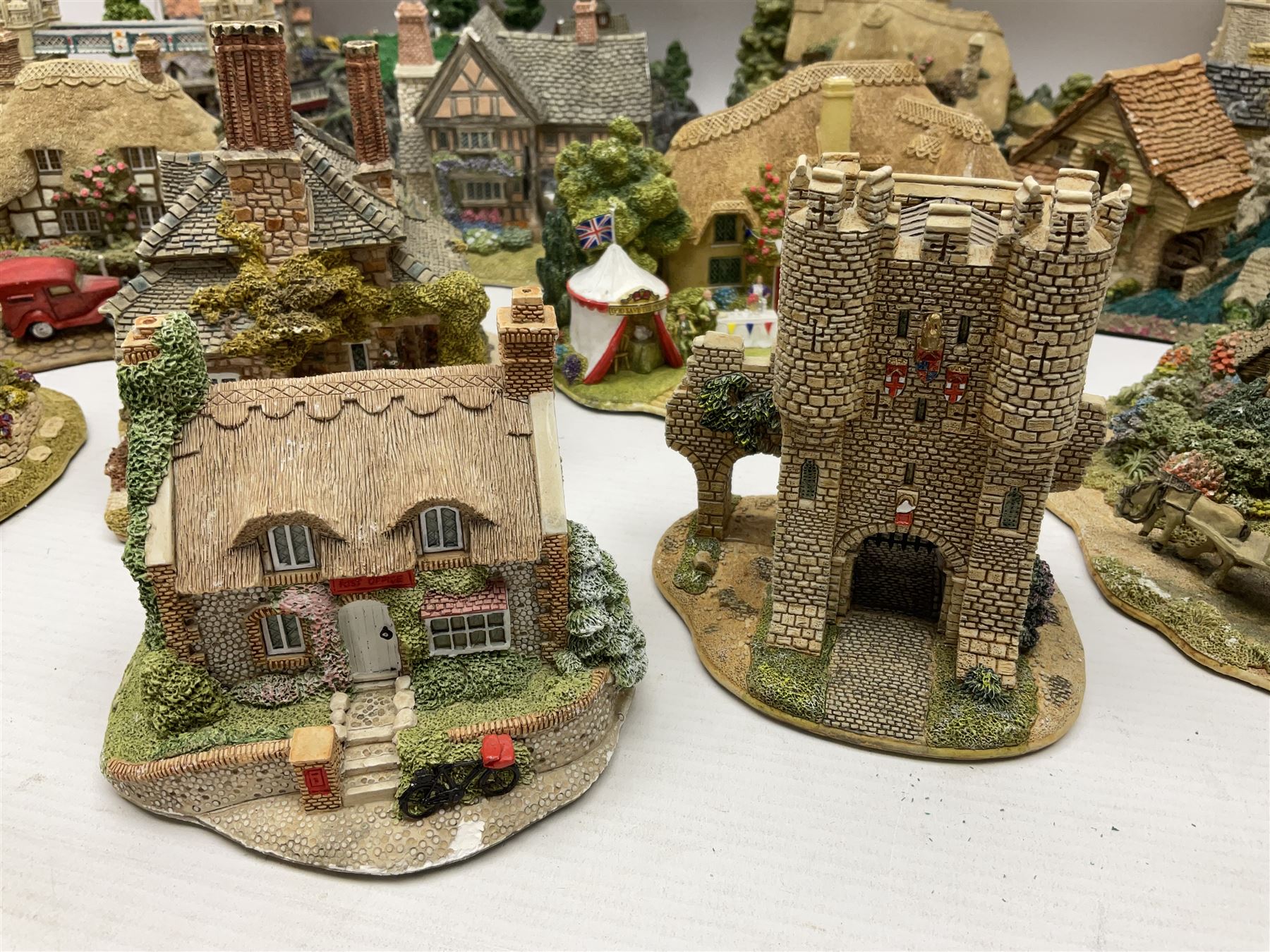 Twenty six Lilliput Lane models, to include Golden Harvest, Junk and Disorderley, Heaven Lea Cottage, Old Scrumpy Farm, Chantry Chapel Wakefield, etc, together with four similar cottages