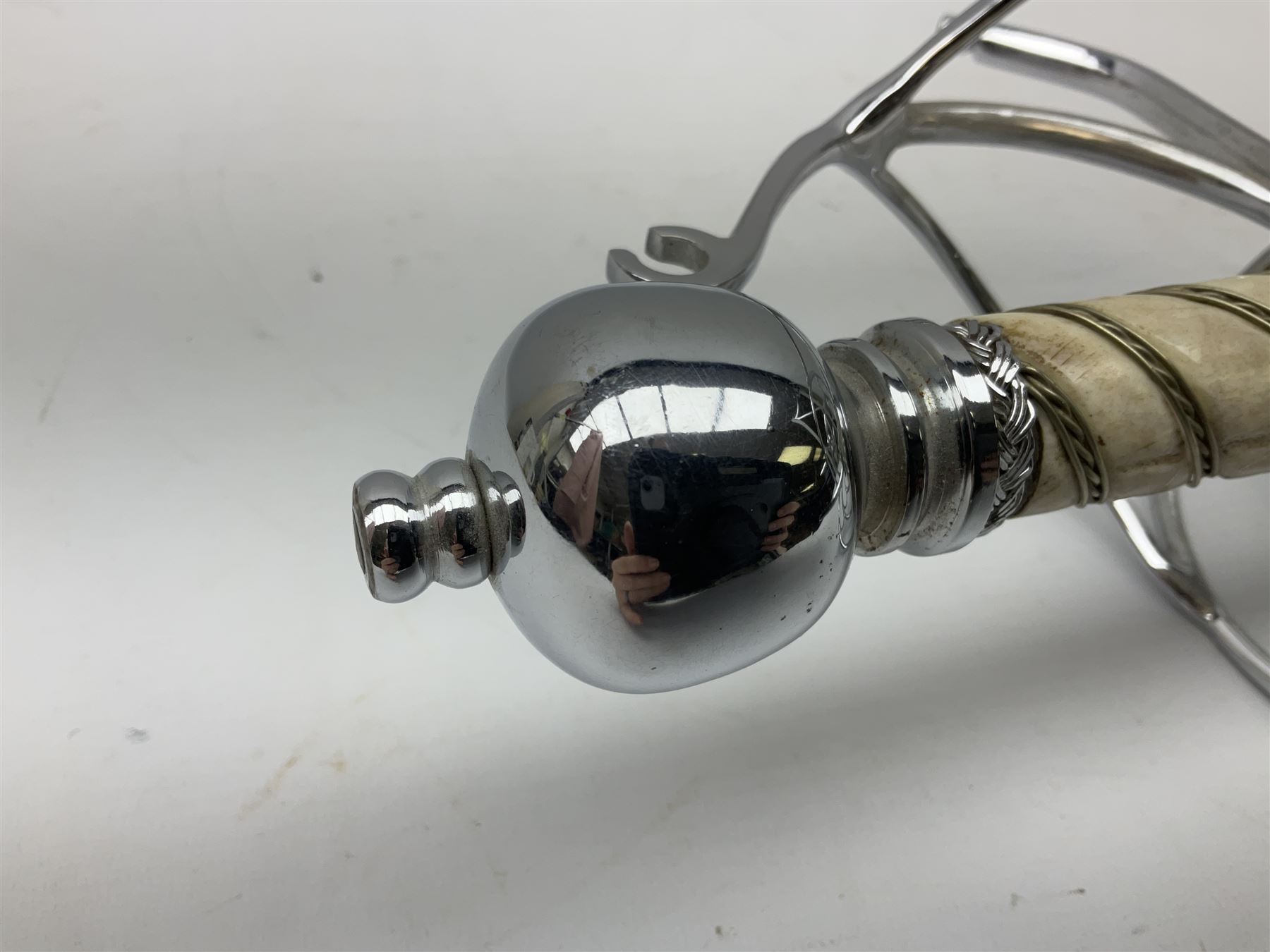 Replica knight's longsword, the 91.5cm double-edged steel blade with basket hilt and wire-bound bone grip with spherical pommel, in leather scabbard L112cm overall