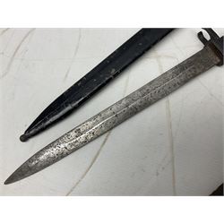British No 7 MKI knife bayonet with 20cm single edged fullered clipped point blade;  blackened steel, large muzzle ring cross-guard; blackened swivelling pommel marked 'F5H'; red Tufnol composite grips; in blackened steel scabbard L33cm overall; British Pattern 1888 bayonet with scabbard; and German Ersatz bayonet with scabbard (3)