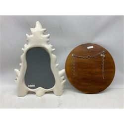 Two mirrors, comprising Art Deco style circular example, and ceramic example of shaped form with encrusted rose detail 