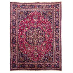 North East Persian Mashad hand-knotted carpet, rich madder red field with central cusped f...