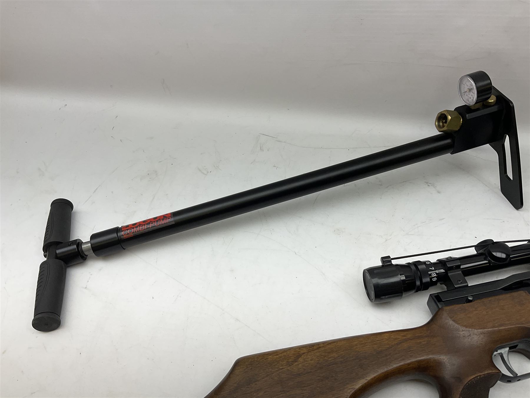 Weihrauch HW100 .22 calibre PCP repeating air rifle; walnut thumbhole stock with textured pistol-grip; Nikko Stirling Silver Crown 3-9x40 telescopic sight; integral sound moderator; No.1901181 L99cm overall; in gun sling; with Logun Combi-Pump and quantity of pellets