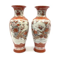 A pair of Japanese Kutani vases, of baluster form decorated with panels of birds and flowers, each with marks beneath, H30cm. 